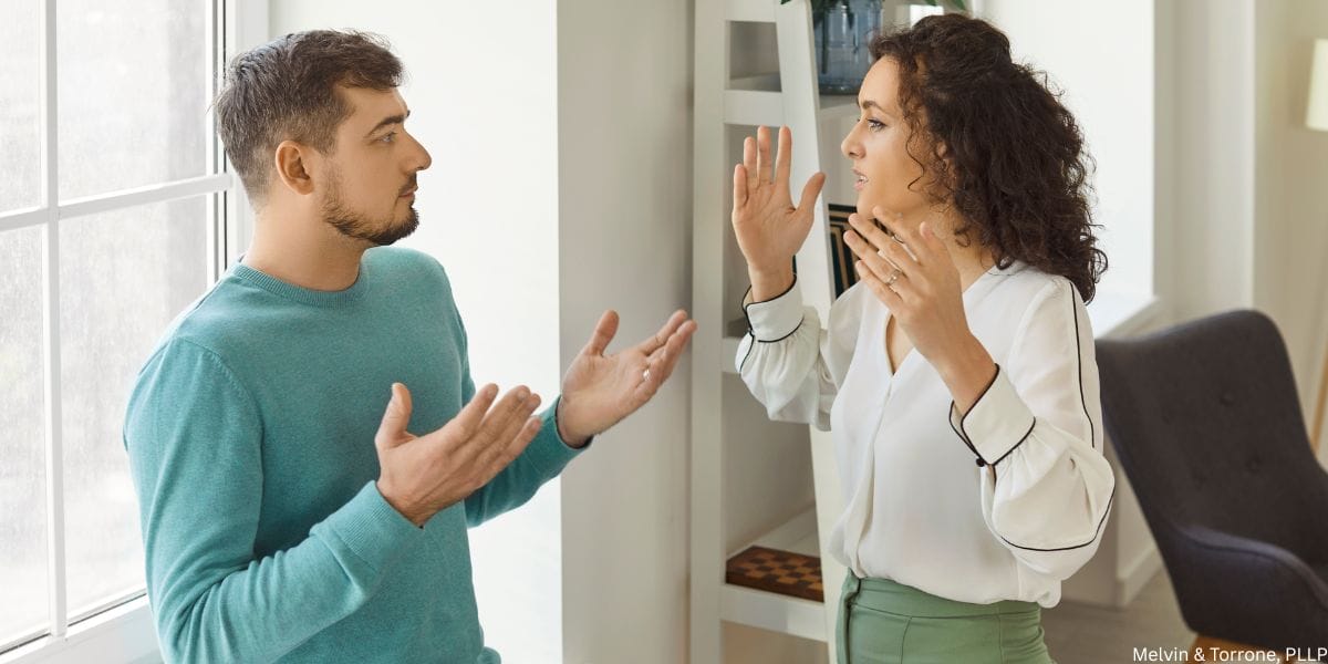 Man reviewing divorce process documents when cheating wife doesn't want a divorce