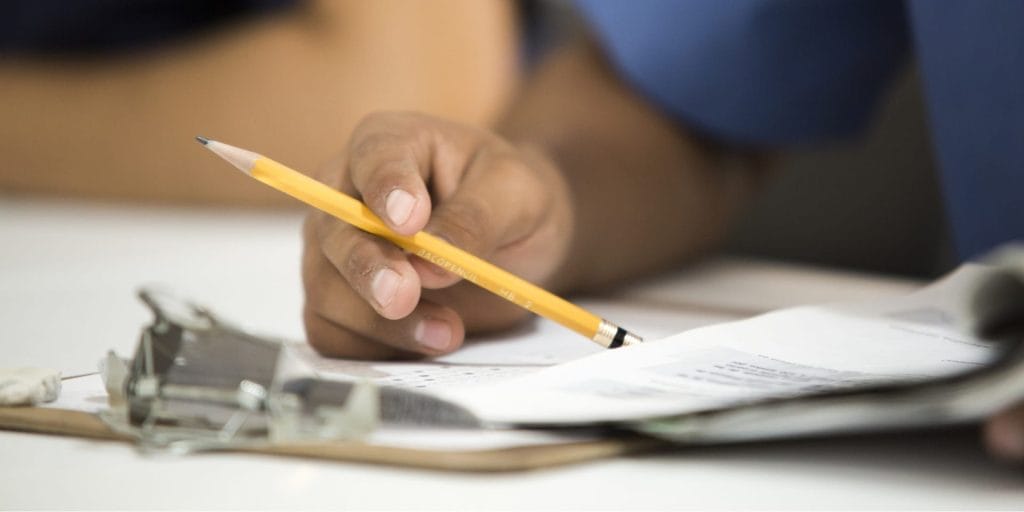 woman filing paperwork for domestic violence by proxy