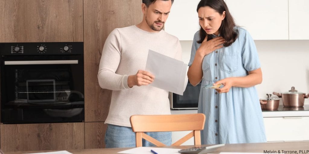 oung married couple discussing finances during the hardest years of marriage