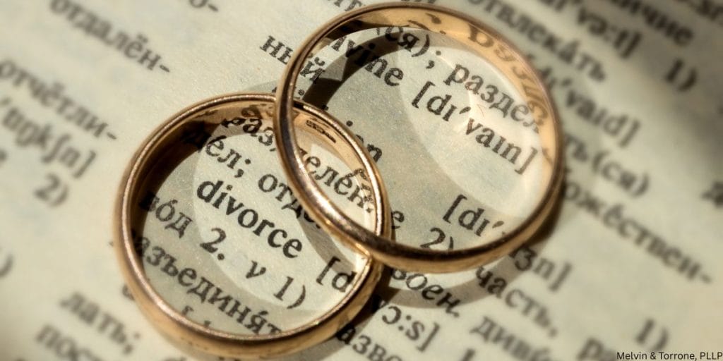 Wedding rings apart representing divorce after infidelity