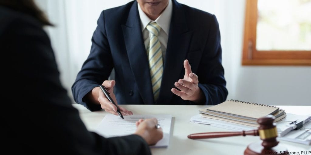Woman discussing signs you should get a divorce during legal consultation